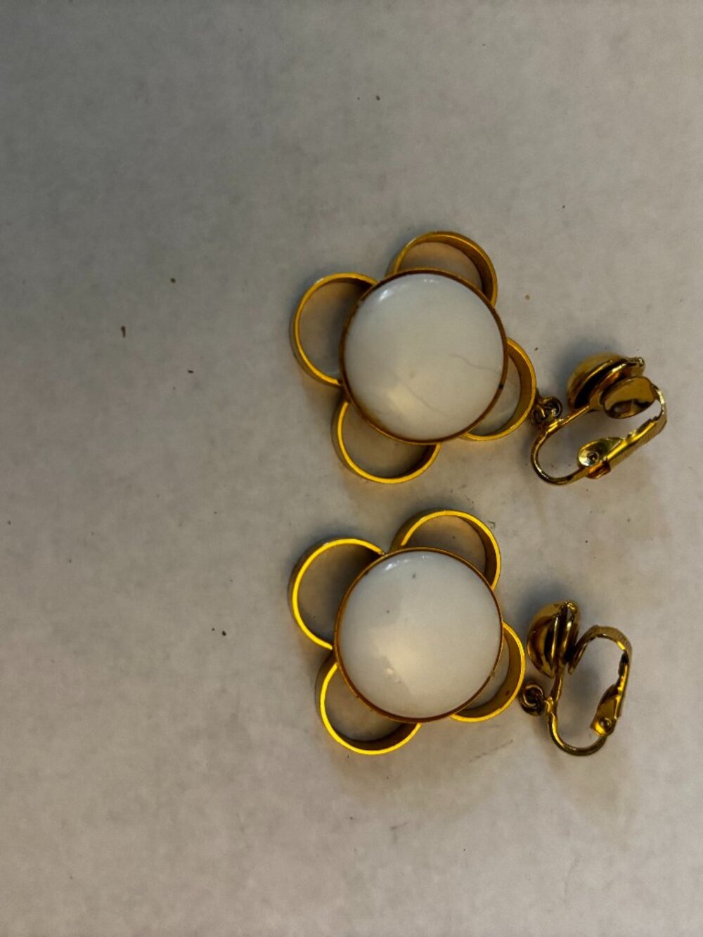 Clip on earrings gold tone loop flower dangles white glass